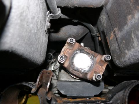 1976 Chevrolet Corvette - Underside view of a vehicle's driveshaft U-joint assembly.
