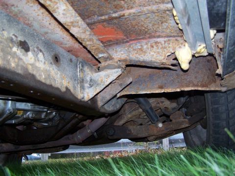 1969 Chevrolet C/K Pickup - Undercarriage view shows significant rust on the frame and suspension parts. Supermotors.net logo is visible in the lower right corner.