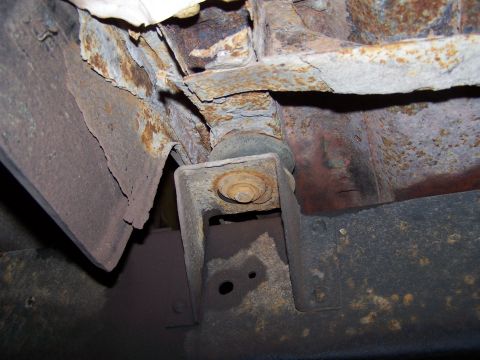 1969 Chevrolet C/K Pickup - The vehicle's frame shows significant rust and deterioration, indicating potential structural issues.