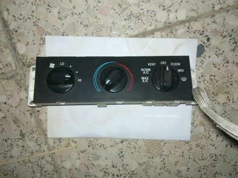 1998 Ford Crown Victoria - Climate control panel from a vehicle, showing fan speed, temperature, and air direction settings.