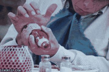 2000 Mercury Grand Marquis - A close-up of hands holding a small, white object.
