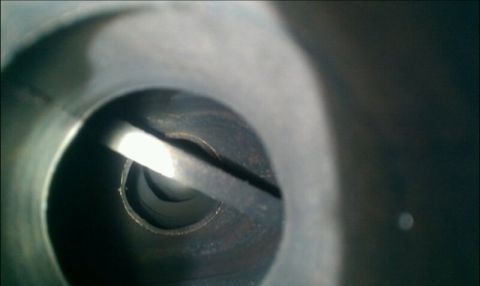 1986 Ford Bronco - Internal view of an engine cylinder, likely showing a valve mechanism.