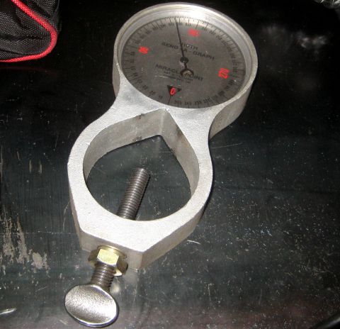 1996 Ford Bronco - Close-up of a Bend-O-Graph gauge, a tool used for measuring bends.