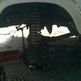 1986 Ford Bronco - This image shows the suspension system of a vehicle, likely during a repair or maintenance procedure.
