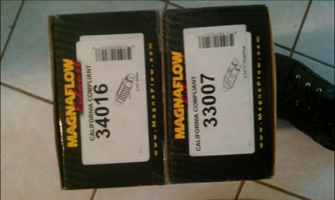 1986 Ford Bronco - Two boxes of Magnaflow exhaust parts are shown, labeled with part numbers and California compliance.
