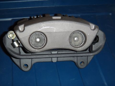 2003 Ford Taurus - Brake caliper shown against a blue background.