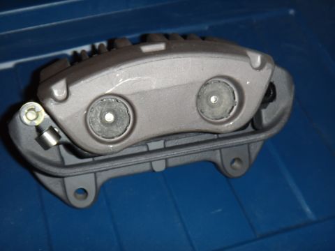 2003 Ford Taurus - A single brake caliper is shown, likely a replacement part, against a blue background.