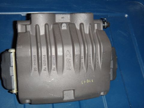 2003 Ford Taurus - A gray PBR brake caliper is shown, with various part numbers and "US PATENT" stamped on its surface.
