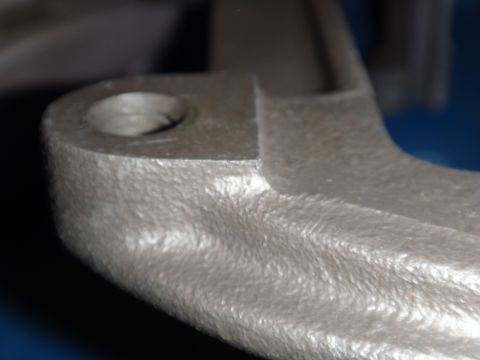2003 Ford Taurus - A metal bracket with a hole is shown in detail.