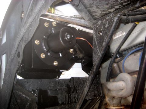 1996 Ford Bronco - Aftermarket blower motor assembly installed in a vehicle's engine bay, likely for HVAC system upgrade.