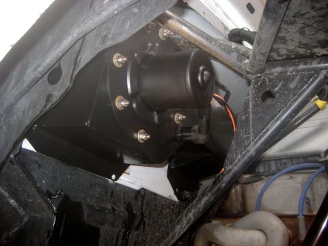 1996 Ford Bronco - Close-up of a vehicle's blower motor assembly, likely for the HVAC system.