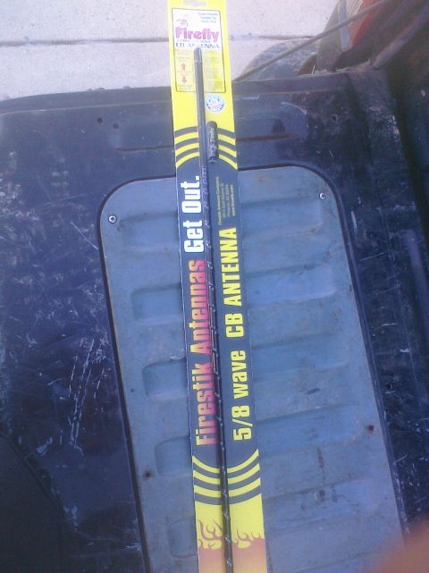 1995 Ford Bronco - Two Firestik CB antennas are shown in their packaging, one labeled 'Firestik Antennas Get Out.' and the other '5/8 wave CB ANTENNA'.