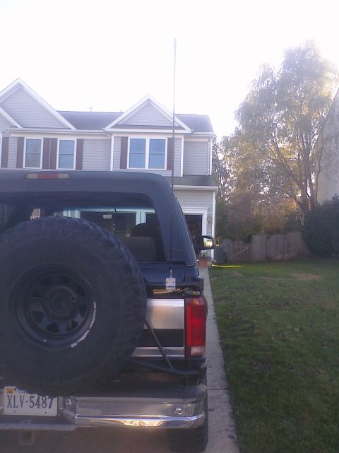 1995 Ford Bronco - This Ford Bronco is parked in a driveway with a house in the background.