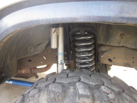 1985 Ford Bronco - Suspension components including shocks and coil spring are visible in this close-up shot.