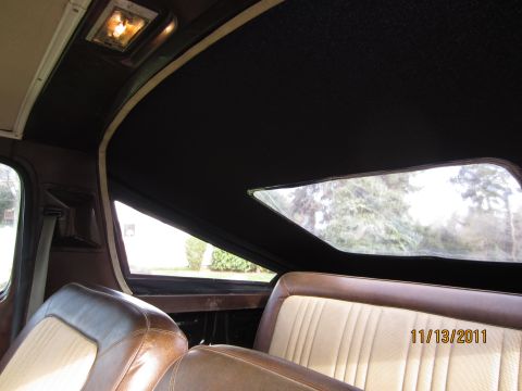 1979 Ford Bronco - Interior view of a vehicle, showing brown seats, a black headliner, and a large skylight window. The date 11/13/2011 is visible.