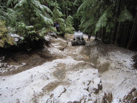 2008 Jeep Wrangler - Off-roading in a vintage Jeep Wrangler on a challenging trail with snow and mud.