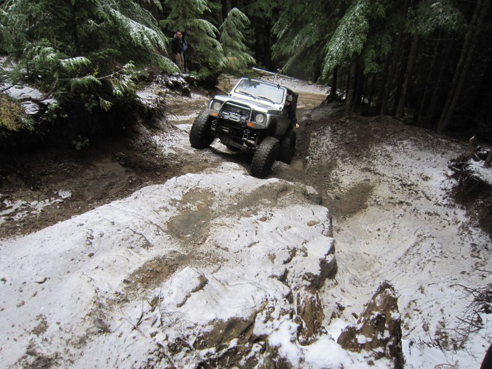 White off-road vehicle on snowy trail