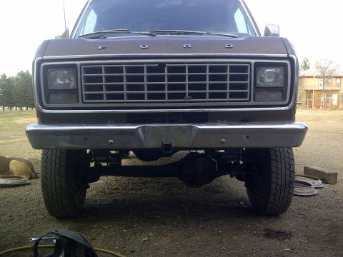 1979 Ford E250 - Front view of a brown Ford van, showing its grille and headlights.