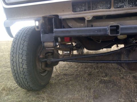 1979 Ford E250 - Front wheel and suspension details of a 1979 Ford E250 van, including a trailer hitch.