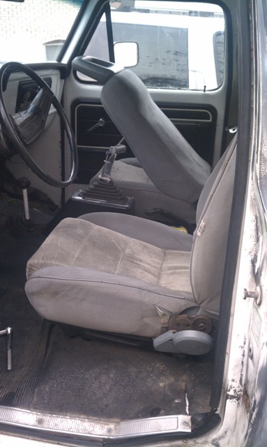 1978 Ford Bronco - Interior view of a truck, focusing on the seats and dashboard area.