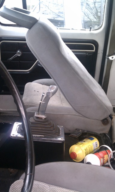 1978 Ford Bronco - Interior of a 1978 Ford Bronco, the gear shifter and seating area.