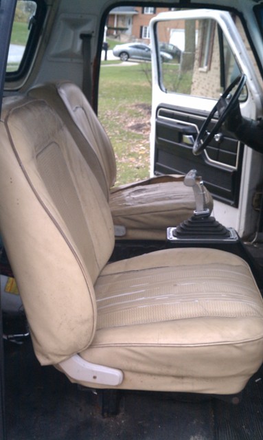 1978 Ford Bronco - View of the interior of a vehicle, focusing on the seats and center console with a floor shifter.