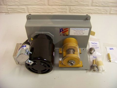 1995 Mercury Grand Marquis - A Giraud Powered Case Trimmer is shown with various accessories and parts, including a motor and a clear reservoir.