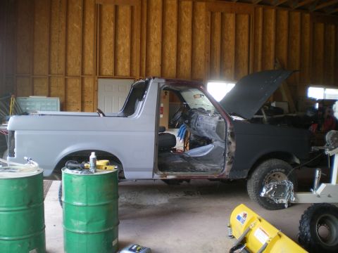 1988 Ford Bronco - This 1988 Ford Bronco is in a garage, appearing to be in the middle of a restoration project.
