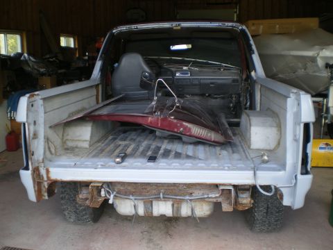 1988 Ford Bronco - This 1988 Ford Bronco is undergoing interior and exterior work, with its doors and other parts stored in the bed.