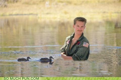 2000 Mercury Grand Marquis - Man in flight suit and ducks in water, with website logos at the bottom.