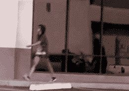 2000 Mercury Grand Marquis - A person walks past a modern building with reflective windows.