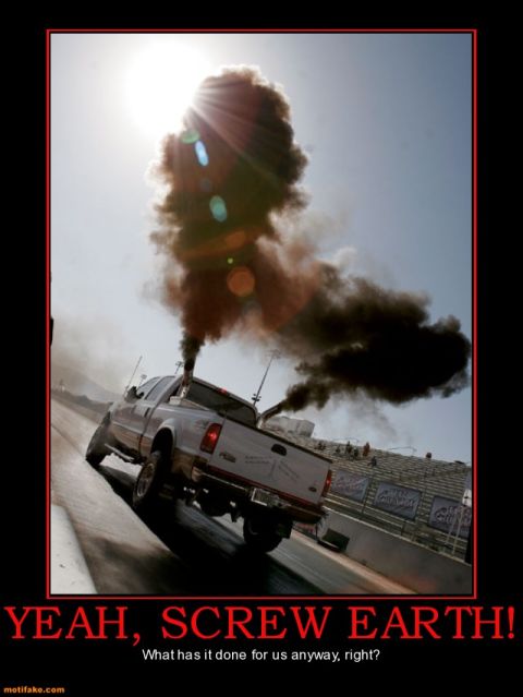 2000 Mercury Grand Marquis - Pickup truck performing a smoky burnout on a drag strip.
