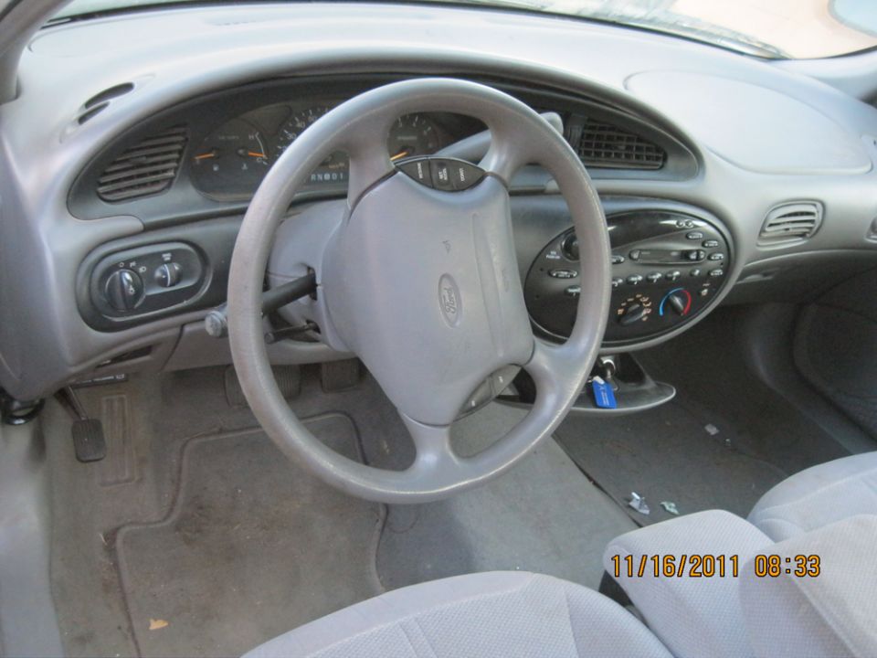 Interior view of a car, showing the dashboard, steering wheel, and seats. Date stamp reads 11/16/2011