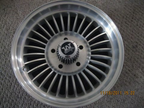 1984 Chevrolet C/K Pickup - Close-up of a Western alloy wheel with a "W WESTERN" center cap.
