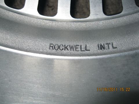 1984 Chevrolet C/K Pickup - A close-up view of a wheel rim shows the manufacturer's mark 'ROCKWELL INTL'.
