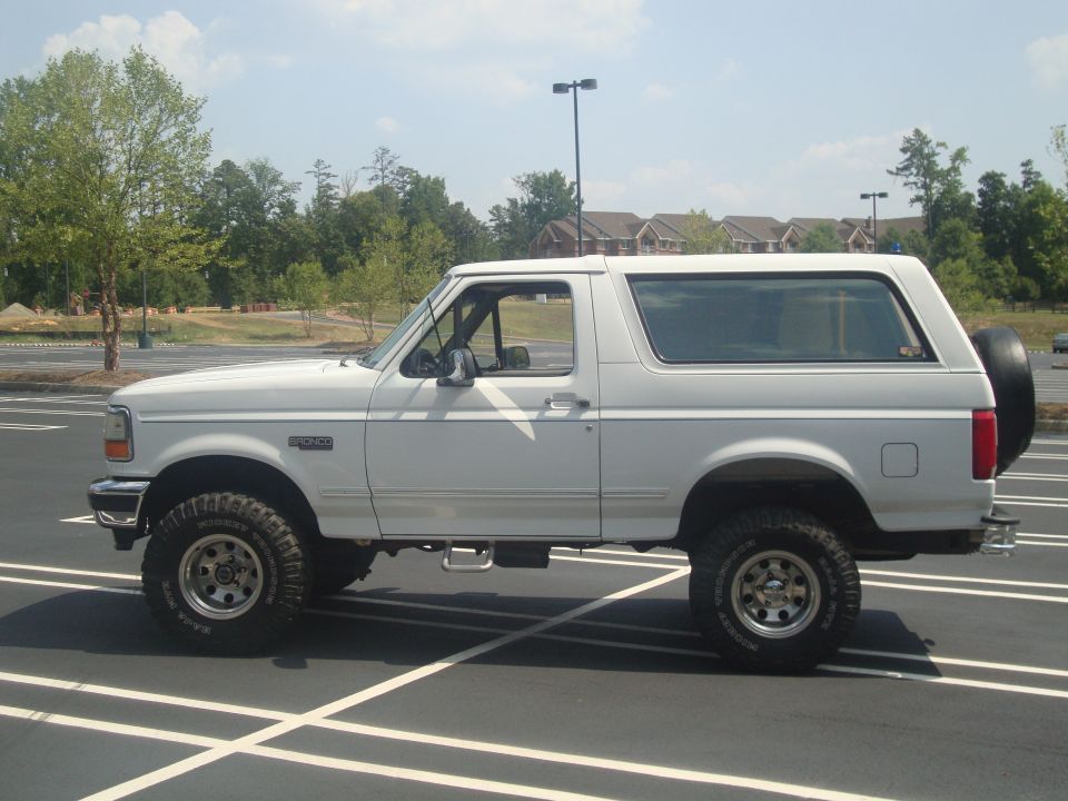 White 1995 Ford Bronco SUV, side view