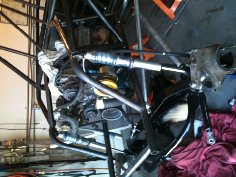 1966 Ford Bronco - Close-up view of the engine and suspension assembly of a custom-built off-road buggy.