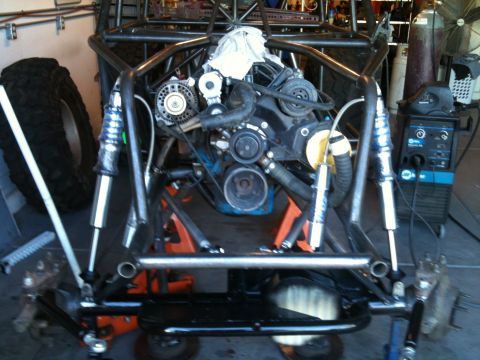 1966 Ford Bronco - Custom buggy chassis undergoing construction with engine and suspension components visible.