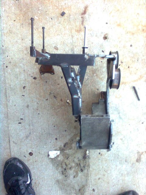 1984 Ford Bronco - Custom fabricated bracket with bolts, likely for a vehicle modification.