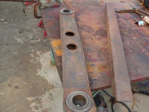 1976 Chevrolet Corvette - A rusty metal part, possibly a suspension component, is shown on a workbench. The registry claims it is from a 1976 Chevrolet Corvette, but…