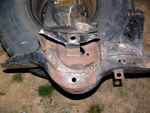 1976 Chevrolet Corvette - Close-up view of a vehicle's rear differential and suspension components, with a tire in the background. The registry claims it is a 1976 C…