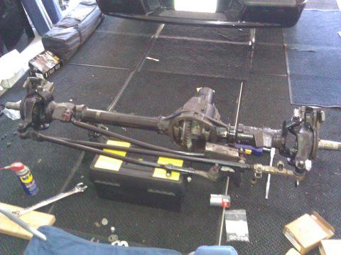 1995 Ford Bronco - Front axle assembly from a 1995 Ford Bronco, showing the differential and steering linkage.