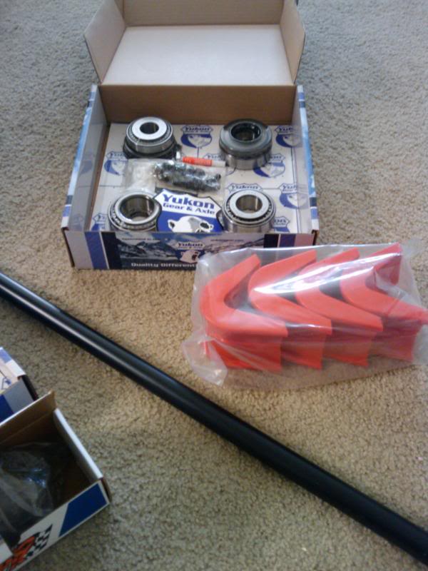 Yukon Gear & Axle bearing kit and red urethane bump stops with a black metal rod