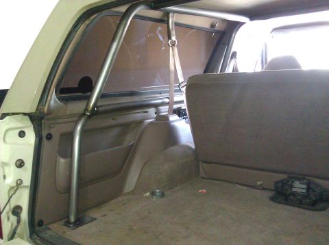1995 Ford Bronco - Custom roll cage installed in the rear interior of a 1995 Ford Bronco.