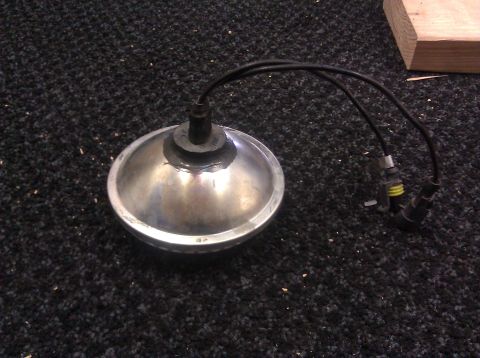 1995 Ford Bronco - Headlight assembly with wiring harness and connectors, likely for an automotive application.