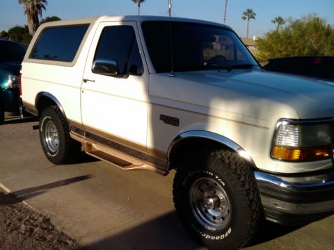 1995 Ford Bronco - This 1995 Ford Bronco is shown from the front three-quarter view, parked outdoors.