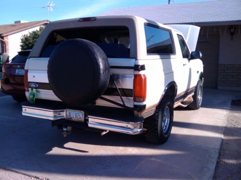 1995 Ford Bronco - This 1995 Ford Bronco is seen from the rear, a spare tire mounted on the tailgate and a license plate reading ALL9247.