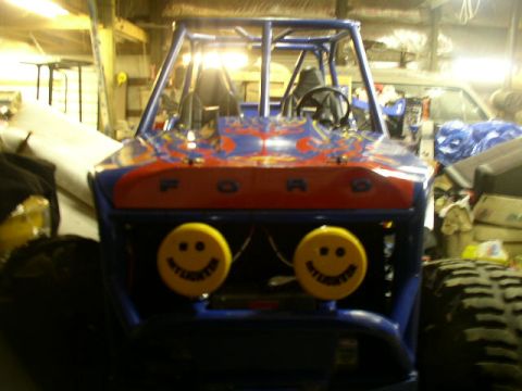 1979 Ford Bronco - Custom buggy with "FORD" lettering and smiley face lights is parked indoors.