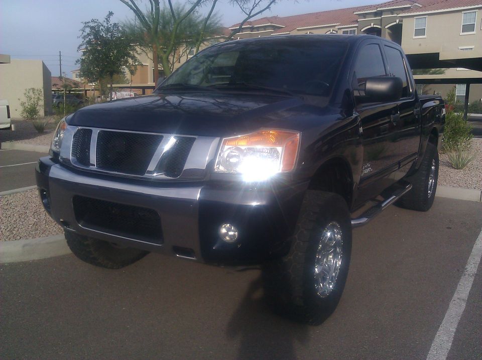 Black 2008 Nissan Titan pickup truck, 3/4 front view