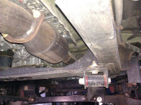 2008 Nissan Titan - The underside of a vehicle is captured, revealing the exhaust system and suspension parts. A Supermotors.net watermark is present.